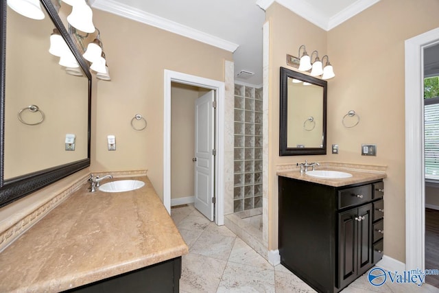 full bathroom featuring a sink, ornamental molding, baseboards, and two vanities