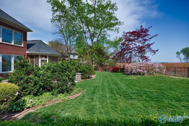 view of yard featuring fence