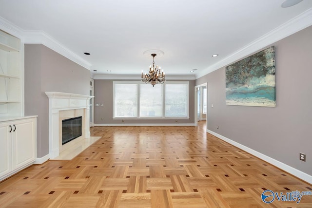 unfurnished living room featuring crown molding, a fireplace, recessed lighting, baseboards, and a notable chandelier
