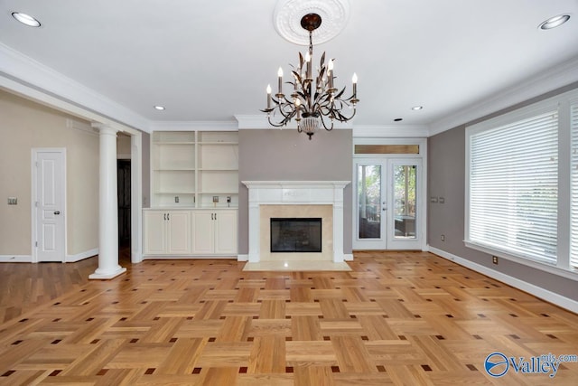 unfurnished living room featuring baseboards, an inviting chandelier, crown molding, recessed lighting, and a premium fireplace