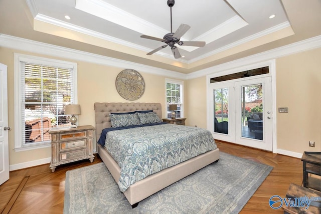 bedroom featuring a tray ceiling and ornamental molding