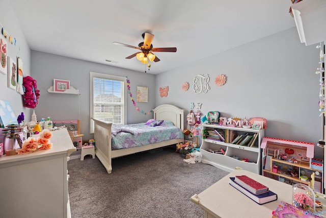 bedroom featuring dark colored carpet and ceiling fan