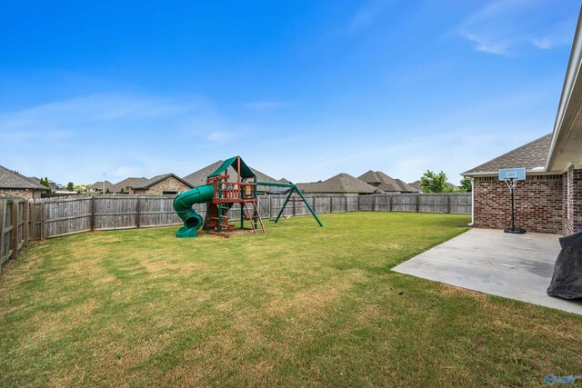 view of yard featuring a patio area and a playground