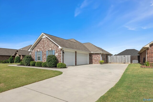 view of front of property featuring a garage and a front yard