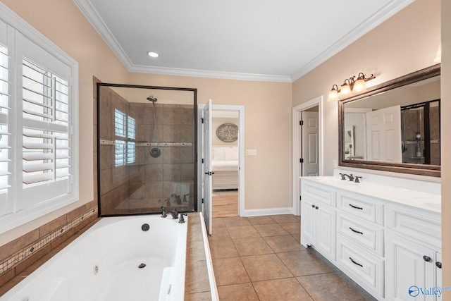 full bathroom with ornamental molding, a sink, a whirlpool tub, and plenty of natural light