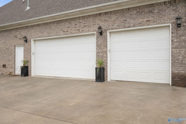 garage featuring driveway