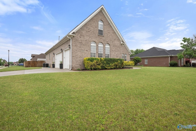 view of home's exterior featuring central air condition unit, a garage, a lawn, brick siding, and concrete driveway