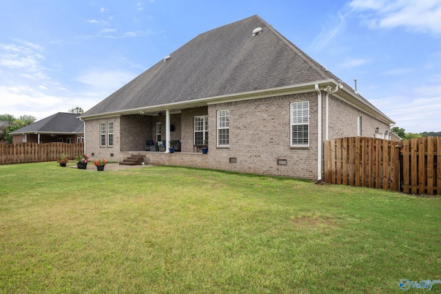 rear view of house featuring fence, a patio area, crawl space, and brick siding