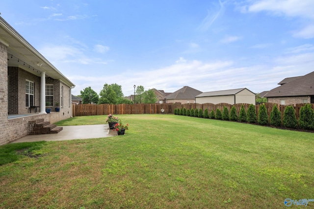view of yard featuring a patio and a fenced backyard