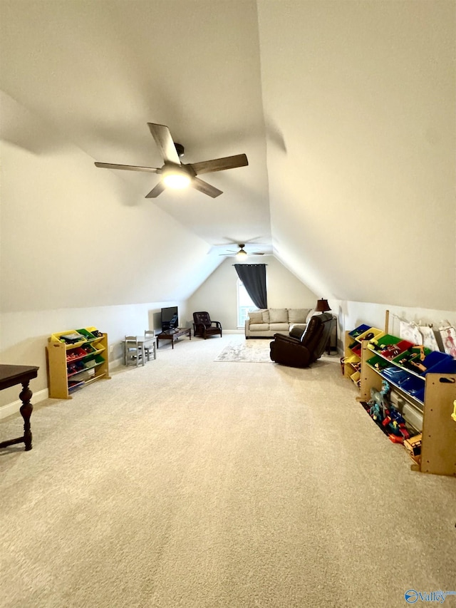 interior space featuring ceiling fan, carpet, and vaulted ceiling