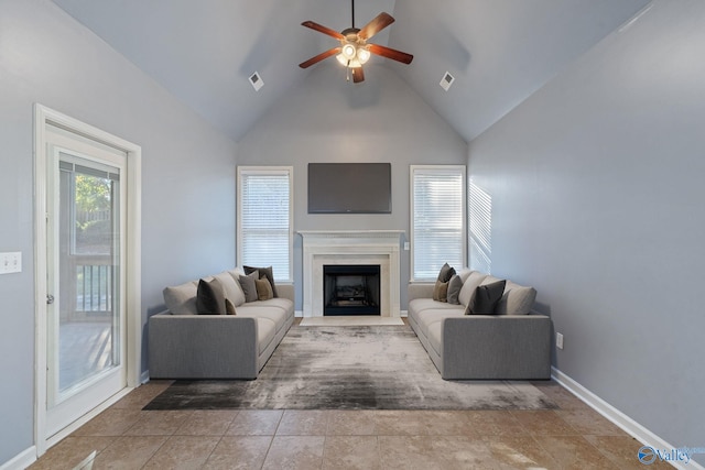 tiled living room featuring high vaulted ceiling and ceiling fan