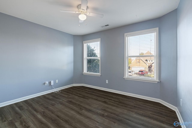 unfurnished room with dark wood-type flooring and ceiling fan