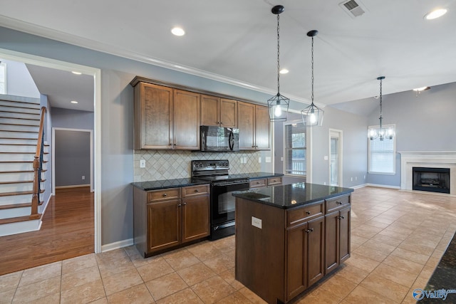 kitchen featuring black appliances, a kitchen island, hanging light fixtures, decorative backsplash, and light tile patterned floors