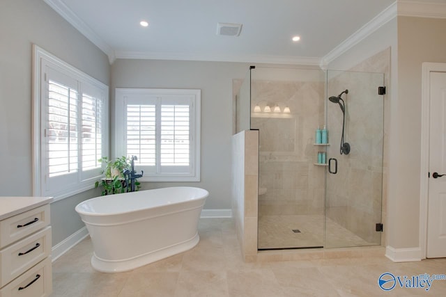 full bath featuring visible vents, ornamental molding, a shower stall, a freestanding tub, and baseboards