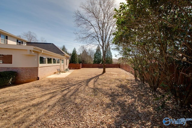 view of yard featuring a fenced backyard and a patio