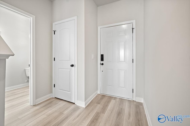 foyer entrance with light wood-type flooring