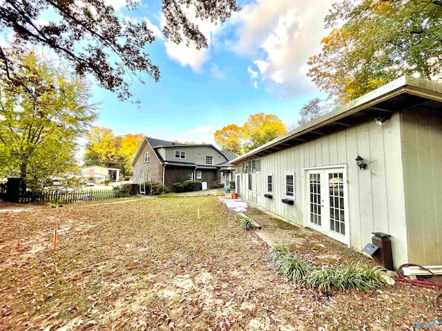 view of side of home with french doors