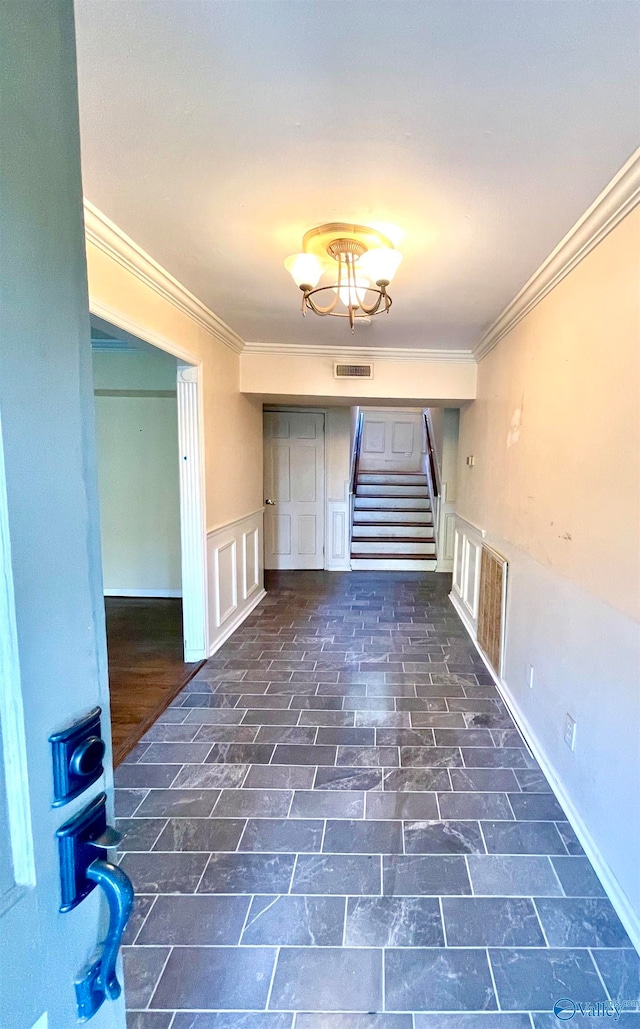 interior space with crown molding