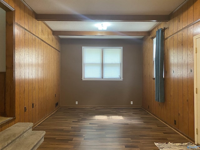 216 Carol Ave, Gadsden, AL 35904 - empty room with beam ceiling, wood walls, wood finished floors, baseboards, and stairs