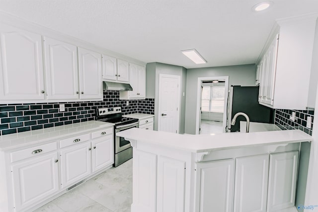 kitchen with a peninsula, stainless steel electric range, white cabinetry, and under cabinet range hood