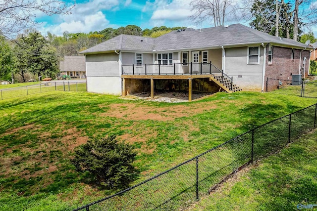 back of property featuring central AC unit, a lawn, a fenced backyard, stairway, and a wooden deck
