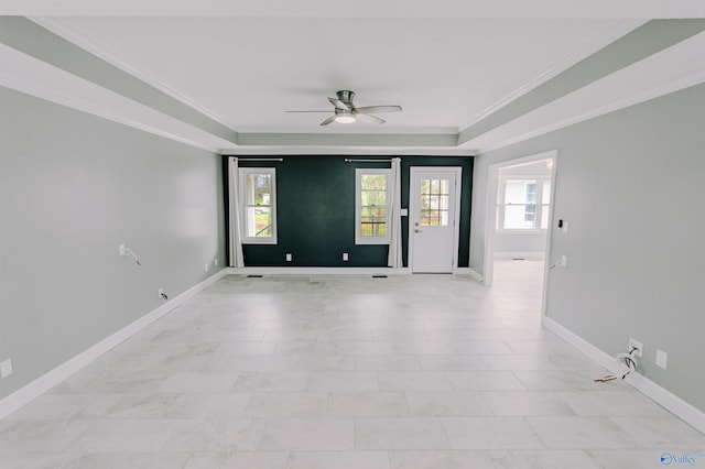 unfurnished room with ornamental molding, baseboards, and a ceiling fan