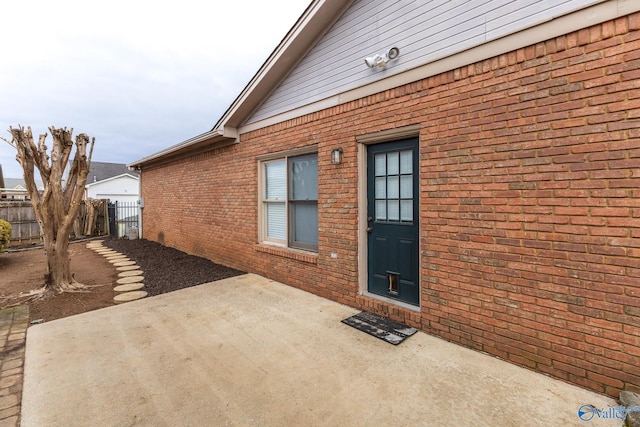 doorway to property with a patio