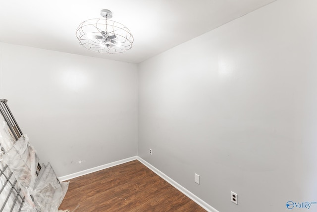 unfurnished room featuring dark wood-type flooring