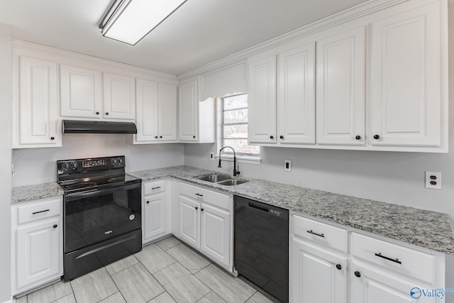 kitchen with sink, white cabinets, light stone counters, and black appliances