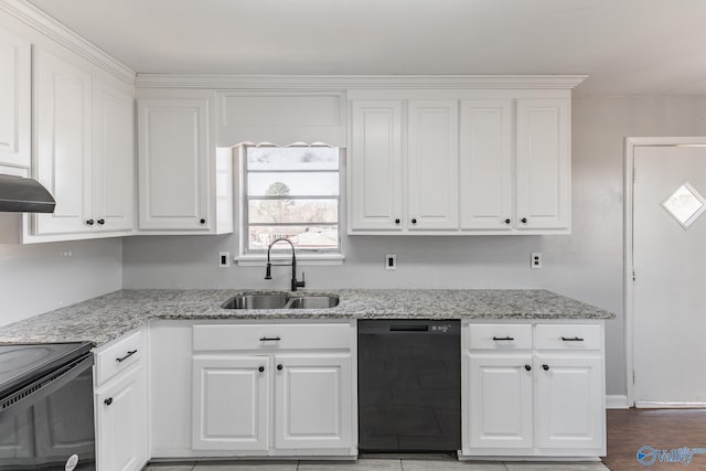 kitchen with black appliances, sink, light stone counters, and white cabinetry