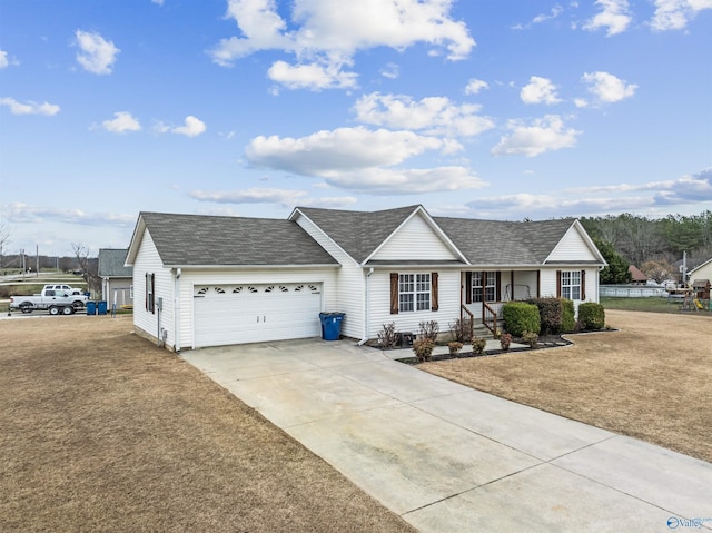 ranch-style house featuring a garage and a front yard