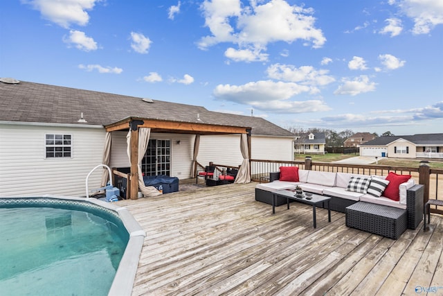 wooden terrace with an outdoor hangout area