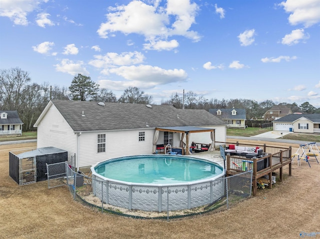 view of pool featuring a yard and central AC