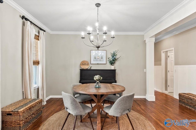 dining area featuring ornamental molding, decorative columns, an inviting chandelier, and dark wood-type flooring