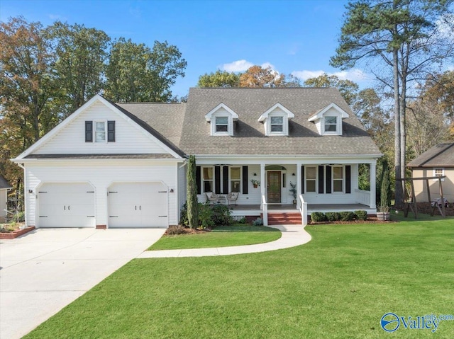 new england style home featuring a garage, covered porch, and a front yard