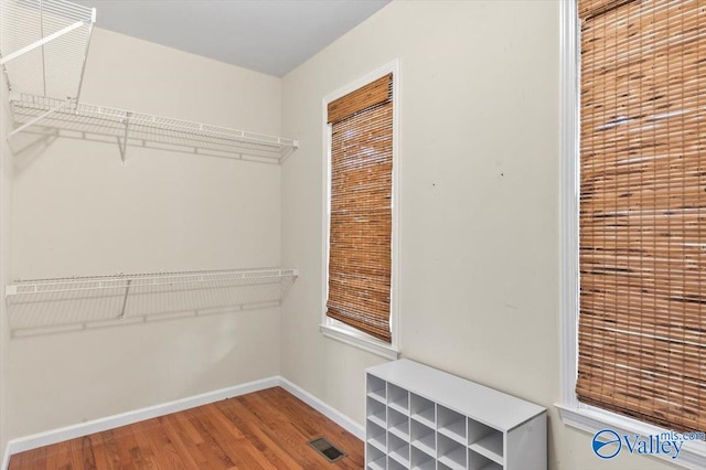 spacious closet featuring hardwood / wood-style floors