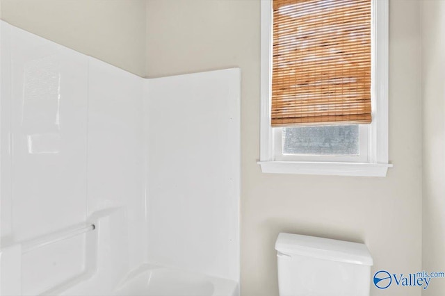 bathroom featuring toilet and a shower