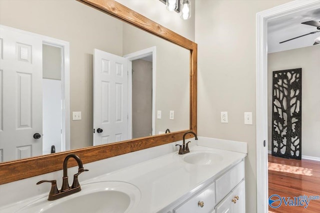 bathroom featuring ceiling fan, vanity, and hardwood / wood-style flooring