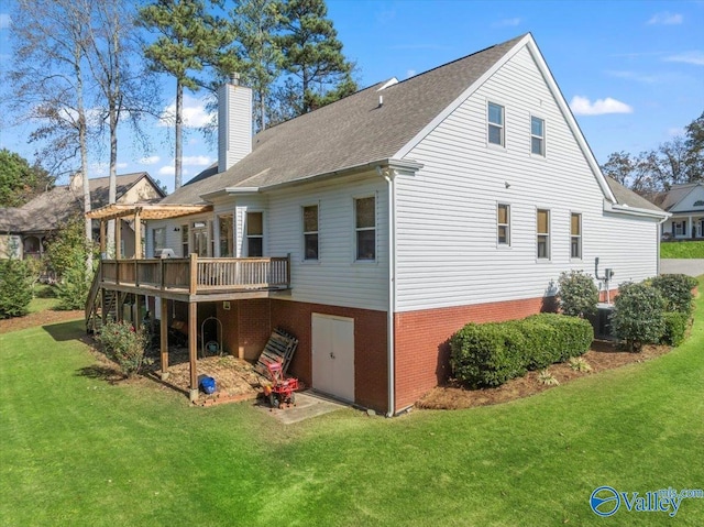 rear view of property featuring central AC unit, a deck, and a yard