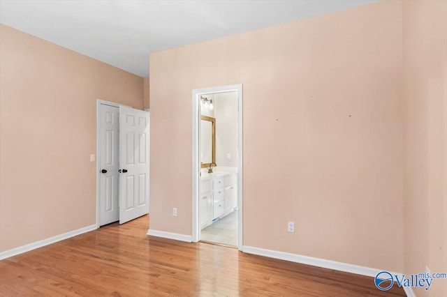 spare room featuring light wood-type flooring