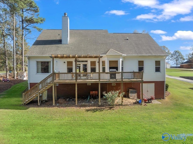 back of property with a lawn, a pergola, and a deck