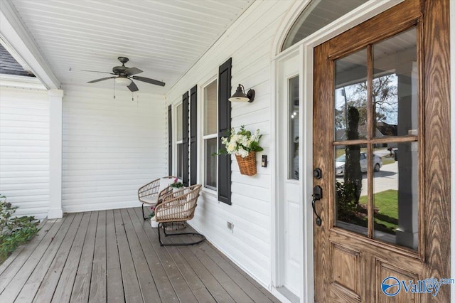 wooden deck featuring ceiling fan and covered porch