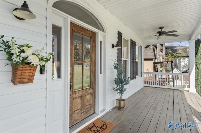 view of exterior entry featuring ceiling fan