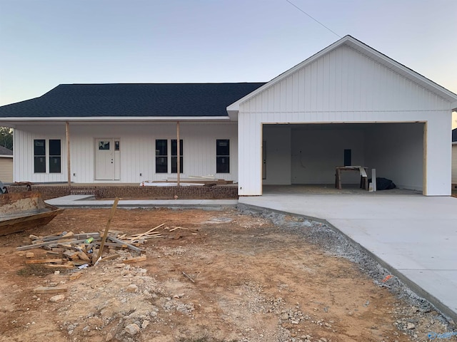 view of front of house with a garage and covered porch