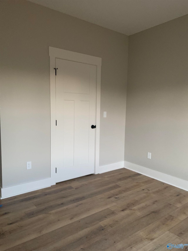 unfurnished bedroom featuring wood-type flooring