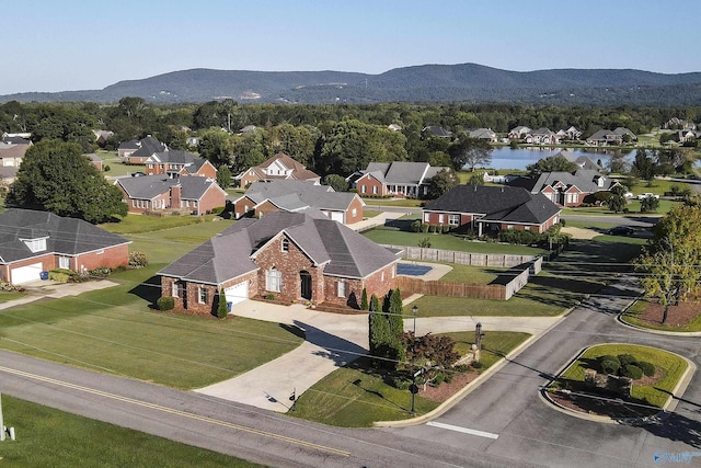 birds eye view of property featuring a mountain view and a residential view