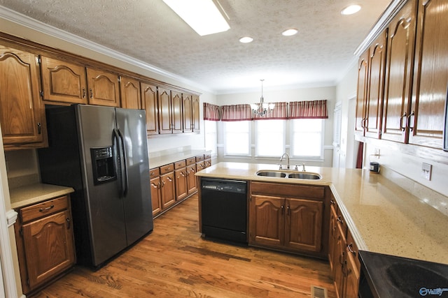 kitchen with stainless steel fridge with ice dispenser, dishwasher, a textured ceiling, and sink