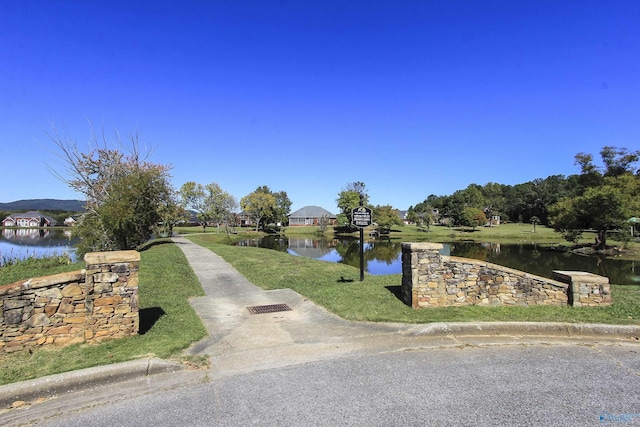 surrounding community featuring a water view