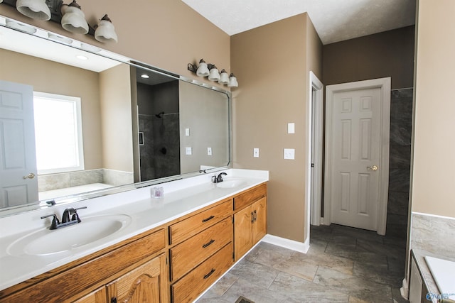 bathroom with vanity and shower with separate bathtub