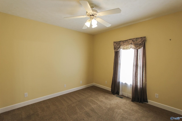 carpeted empty room with ceiling fan